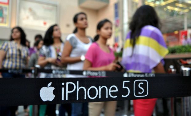 Customers wait outside an Apple Store to purchase the new iPhone 5S and iPhone 5C mobile phones in Ahmedabad - PTI/File photo Customers wait outside an Apple Store to purchase the new iPhone 5S and iPhone 5C mobile phones in Ahmedabad - PTI/File photo